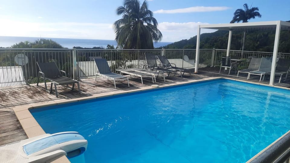 View (from property/room), Pool view, Sea view, Swimming pool, sunbed