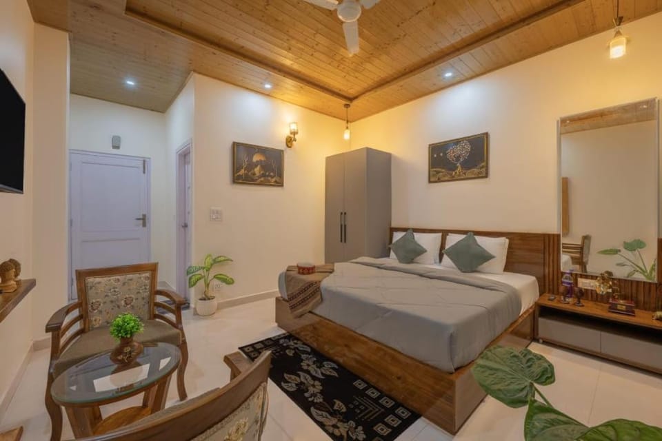 Bed, TV and multimedia, Living room, Seating area, Bedroom, towels, wardrobe, air conditioner