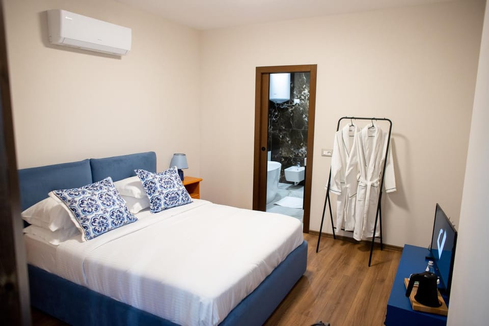 Bed, Photo of the whole room, Bedroom, towels, air conditioner
