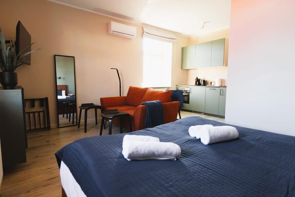 Bed, Kitchen or kitchenette, Seating area