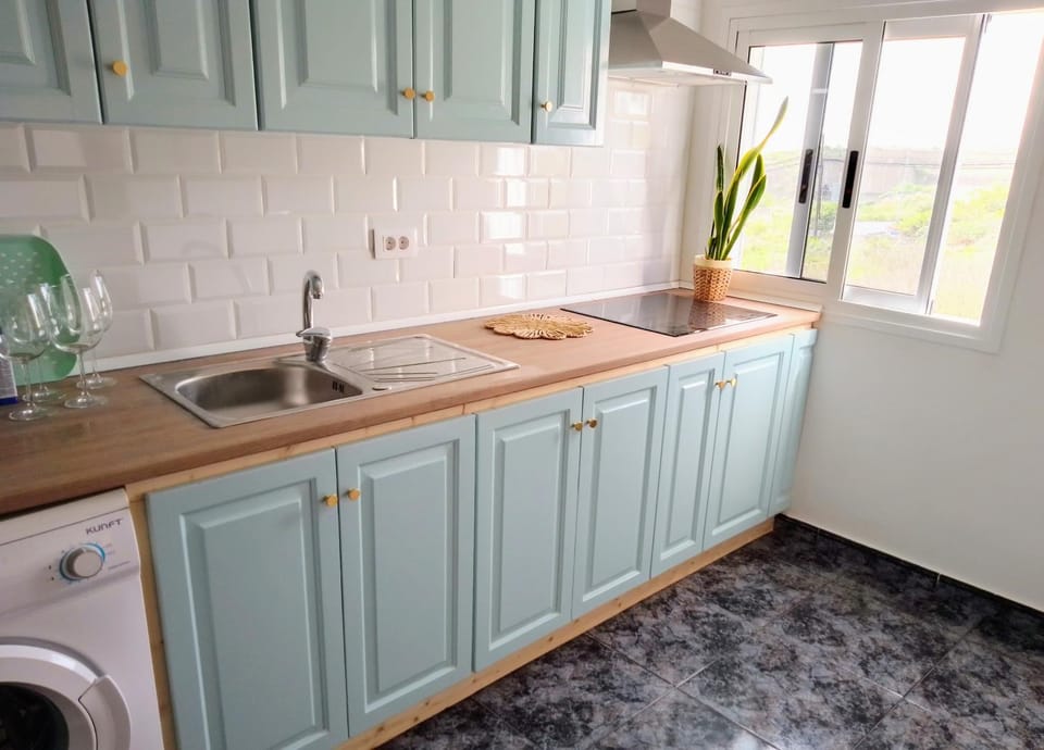 Kitchen or kitchenette, stove, washing machine