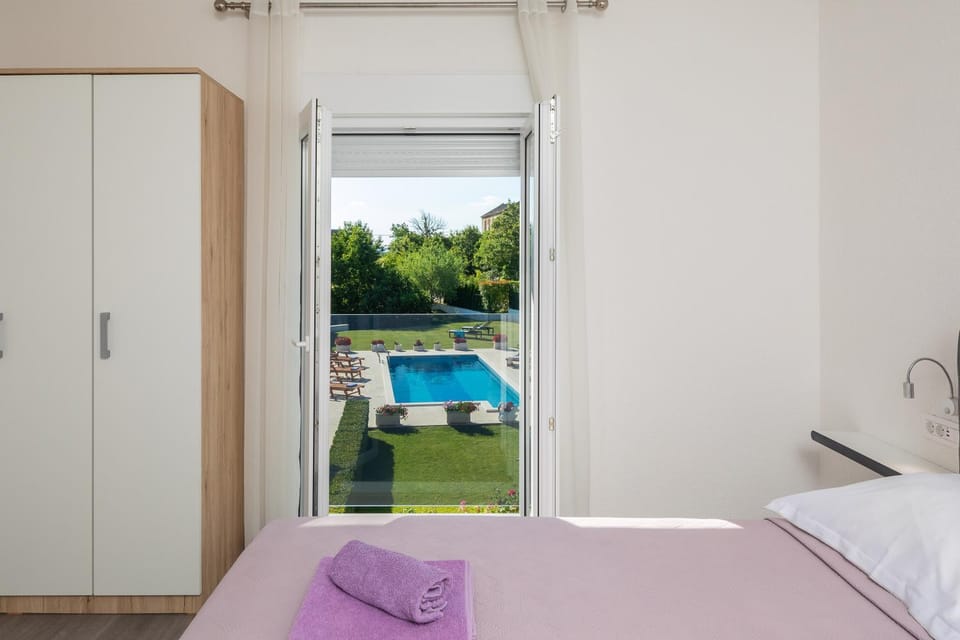 Bed, Bedroom, Pool view, Swimming pool