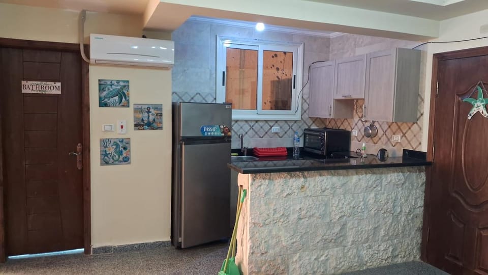 Kitchen or kitchenette, oven, air conditioner