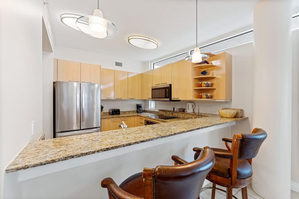 Kitchen or kitchenette, dishwasher, oven, stove