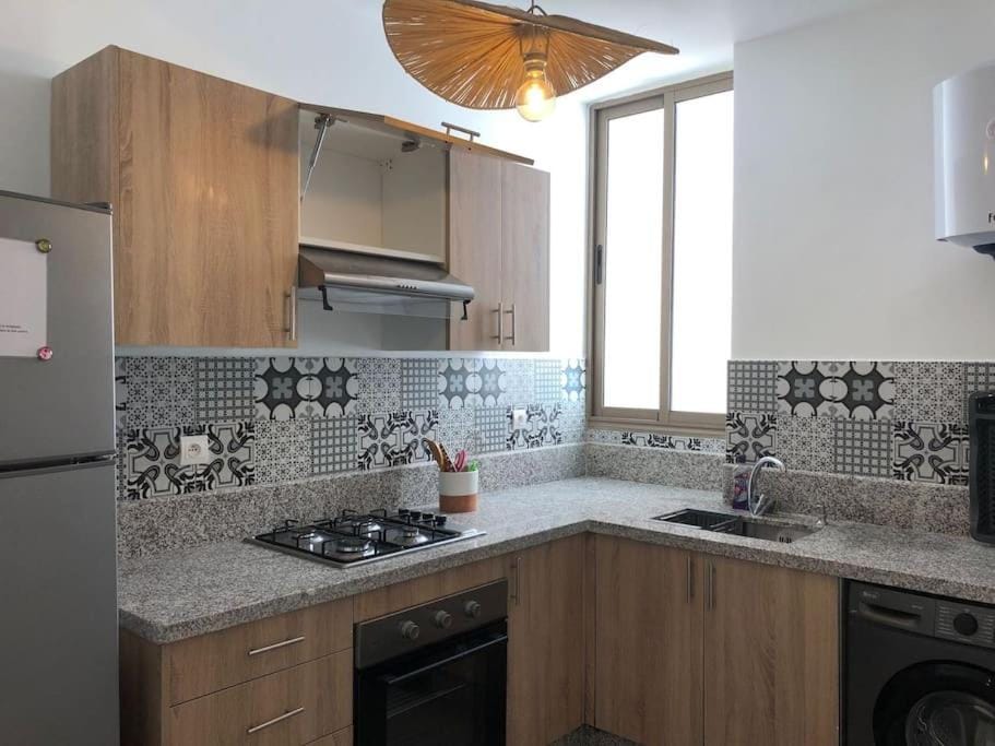 Kitchen or kitchenette, oven, stove, washing machine
