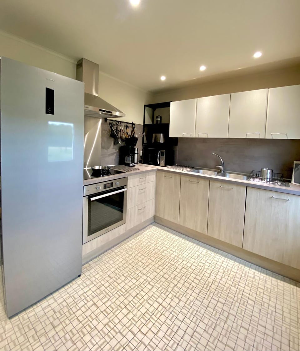 Kitchen or kitchenette, dishwasher, oven, stove