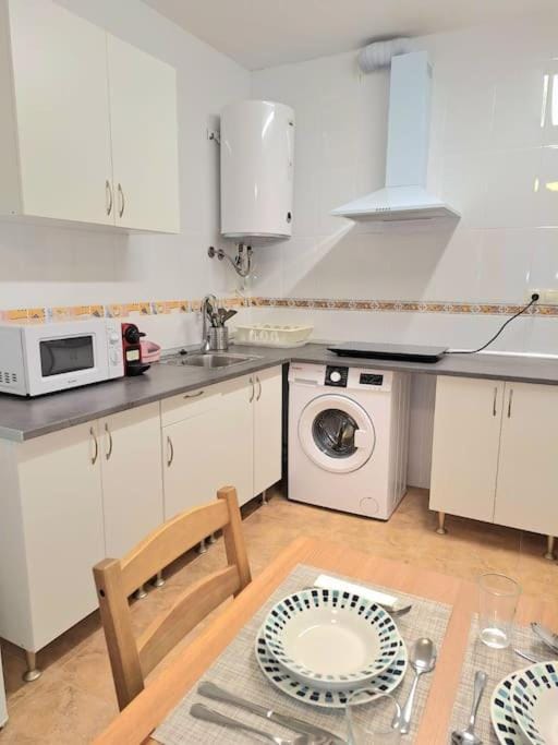 Kitchen or kitchenette, minibar, stove, washing machine