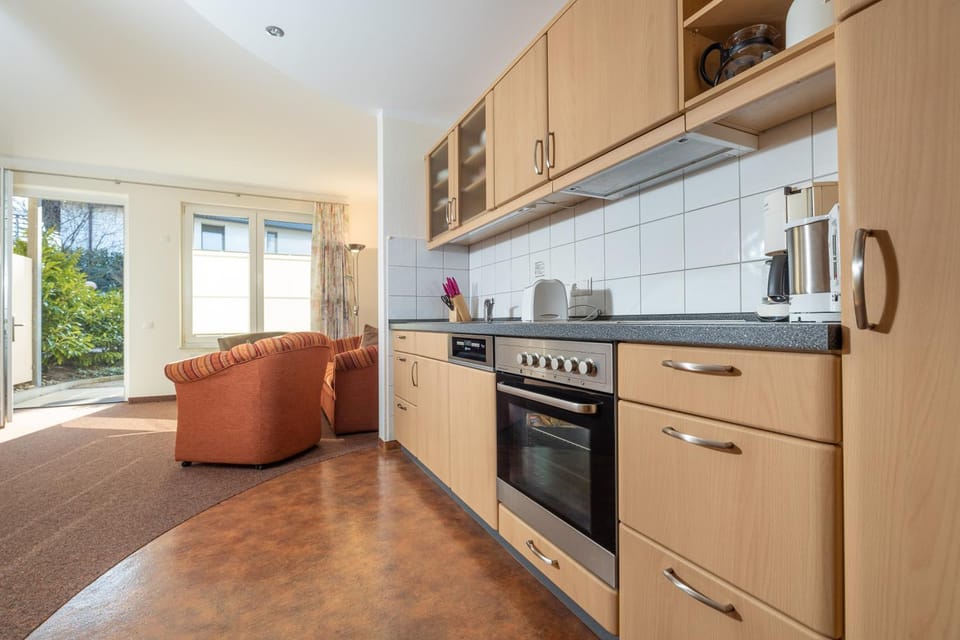 Kitchen or kitchenette, dishwasher, oven, stove