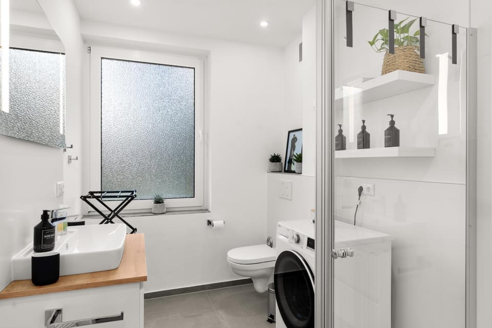 Toilet, Bathroom, towels, washing machine, dryer