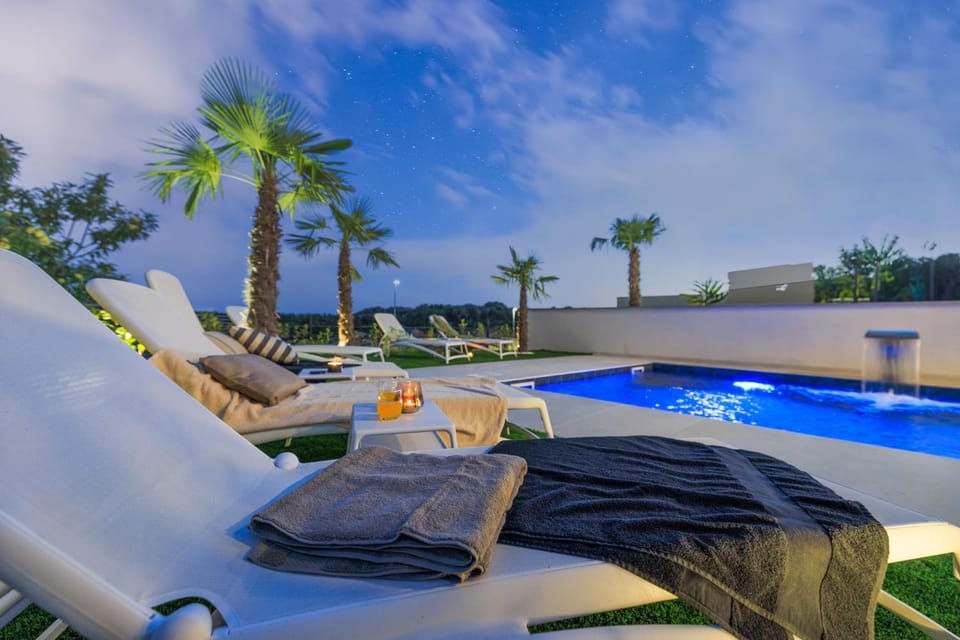 Deluxe villa with heated pool, whirpool, sea view, beautiful beach IV - by Traveler tourist agency Krk ID 2403 Villa in Krk