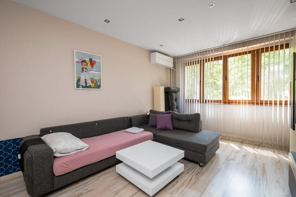 Bed, TV and multimedia, Living room, Seating area, air conditioner
