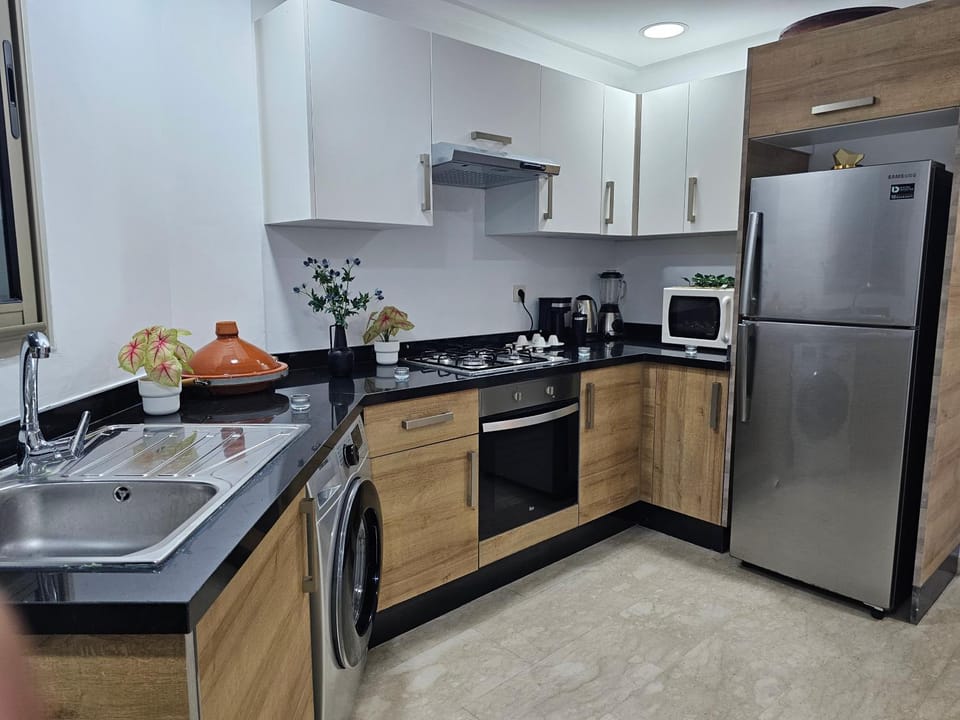 Kitchen or kitchenette, oven, stove, washing machine