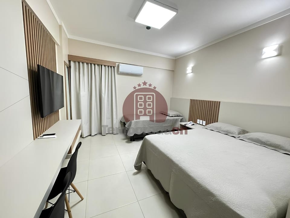 Communal lounge/ TV room, Bed, Property logo or sign, TV and multimedia, Photo of the whole room, Evening entertainment, Logo/Certificate/Sign, Bedroom, Certificate/Award, hair dresser