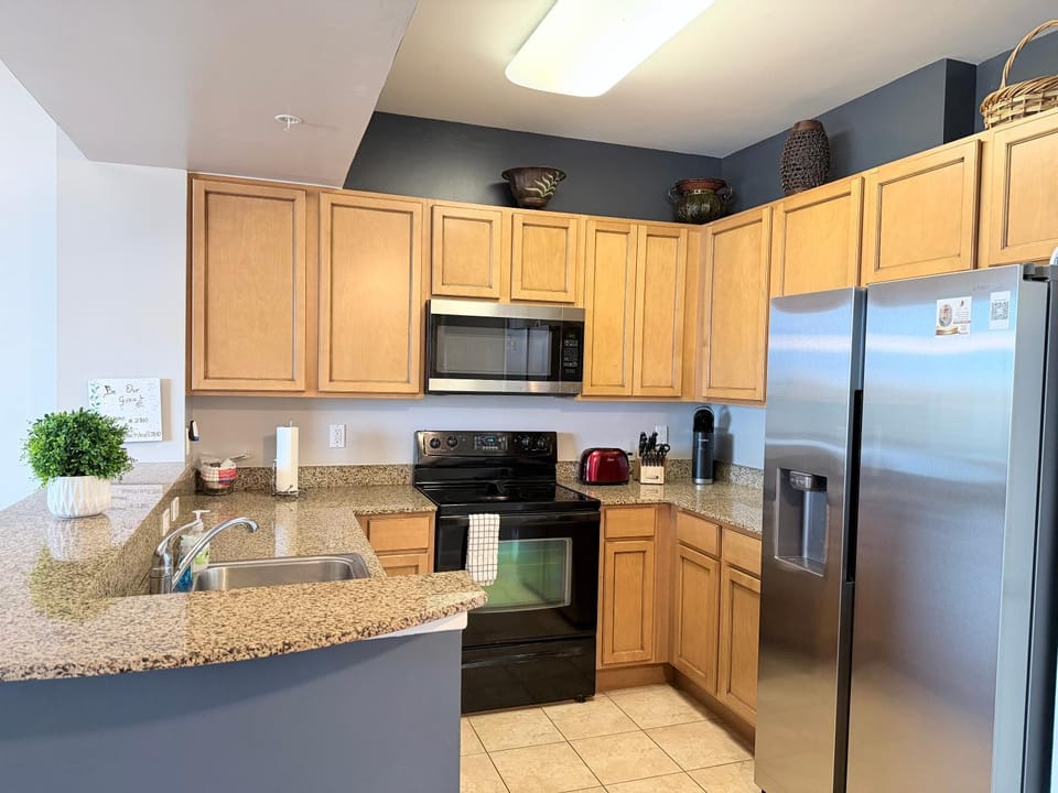 Kitchen or kitchenette, dishwasher, oven, stove