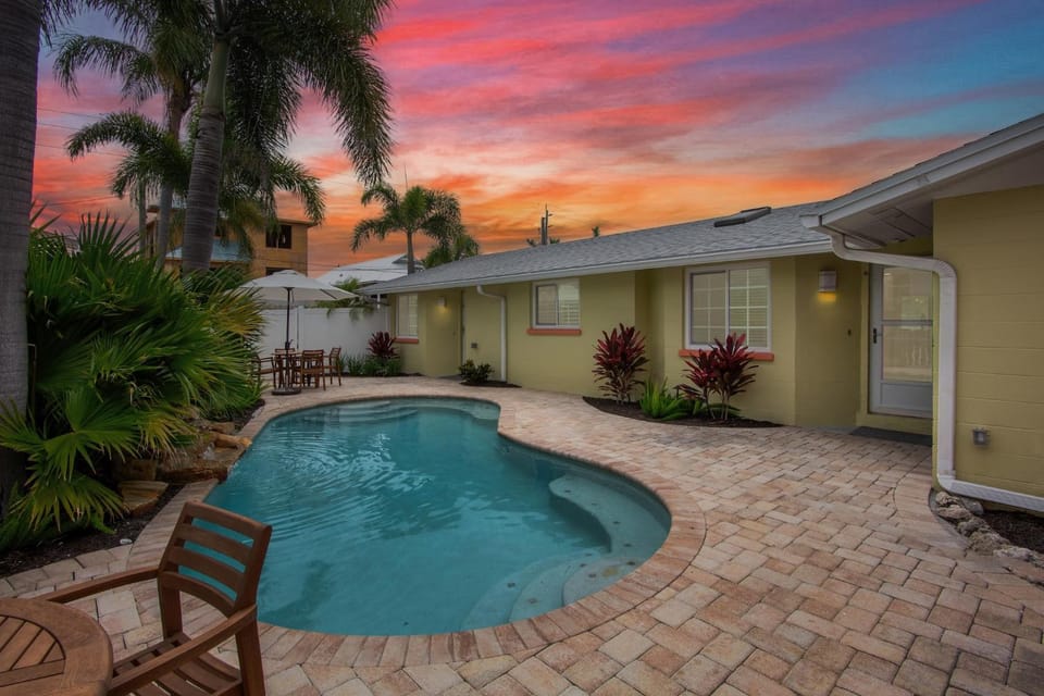 Property building, Patio, Natural landscape, Garden, Swimming pool, Sunset