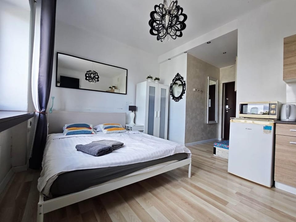 Bed, microwave, towels, wardrobe