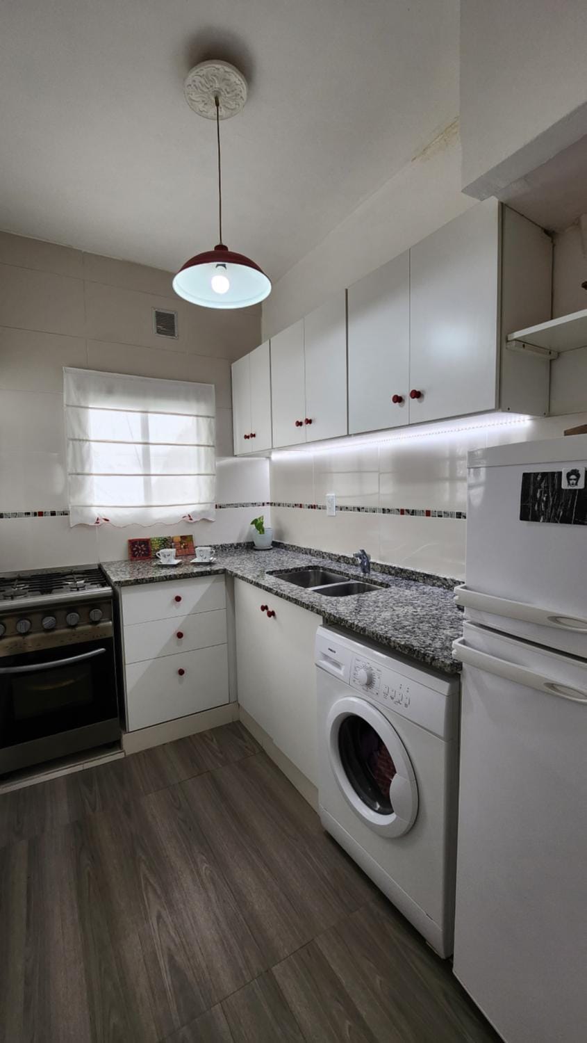 Kitchen or kitchenette, microwave, oven, washing machine