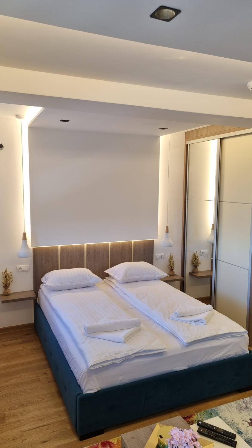 Bed, towels, wardrobe