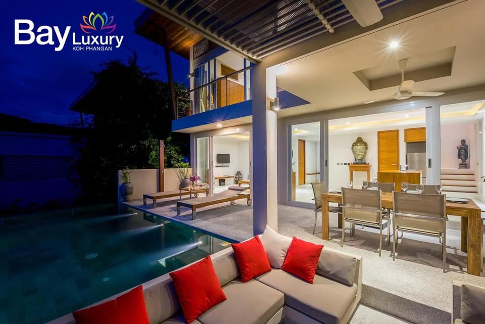 Property building, Patio, Night, View (from property/room), Balcony/Terrace, Living room, Seating area, Dining area, Pool view, Swimming pool, sunbed