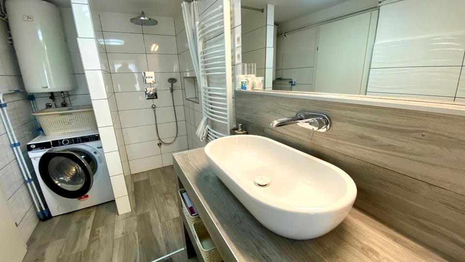 Bathroom, hair dryier, washing machine
