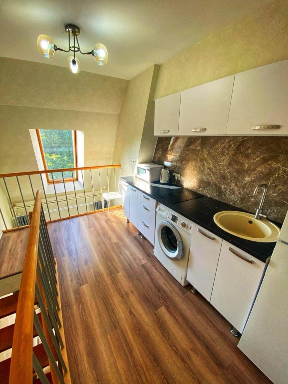 Kitchen or kitchenette, stove, washing machine