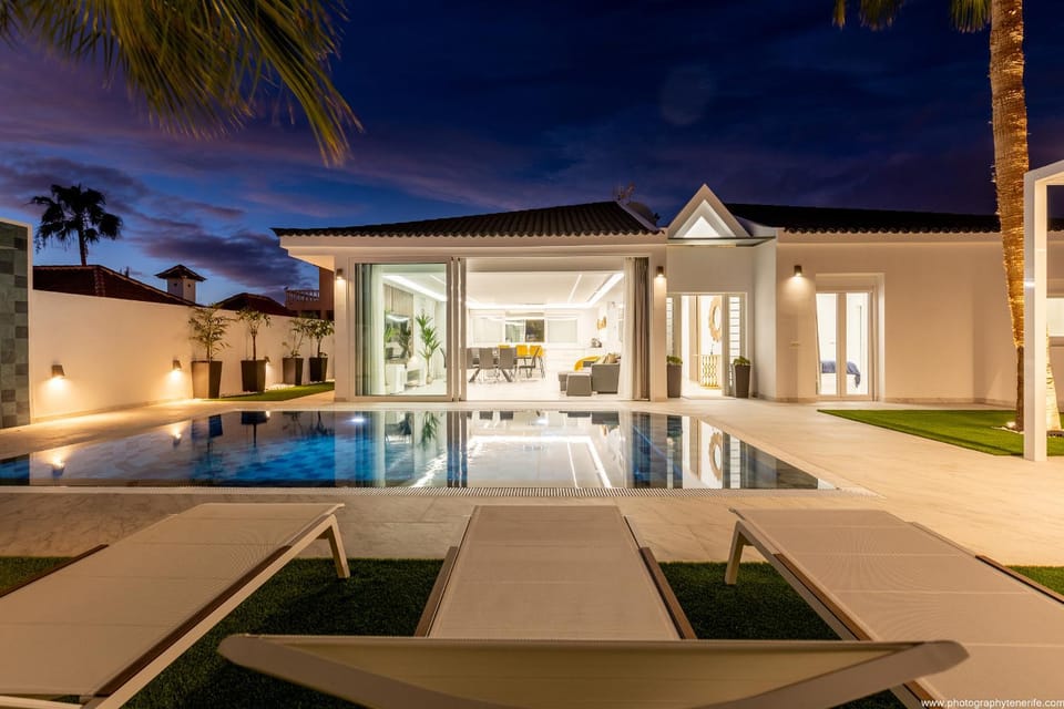 Property building, Patio, Night, Pool view, Swimming pool, sunbed