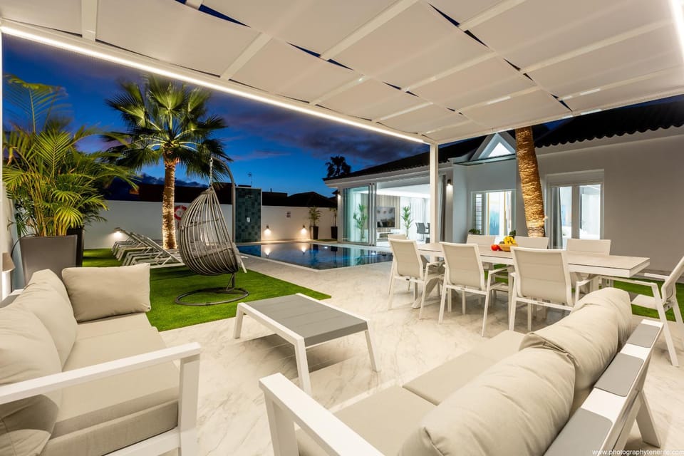 Patio, Living room, Seating area, Pool view, Swimming pool, sunbed