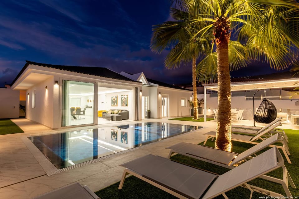 Property building, Patio, Night, Pool view, Swimming pool, sunbed