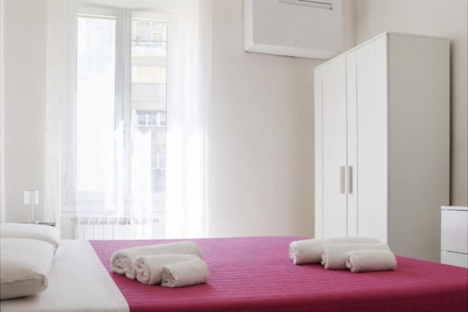 Bed, towels, wardrobe, air conditioner