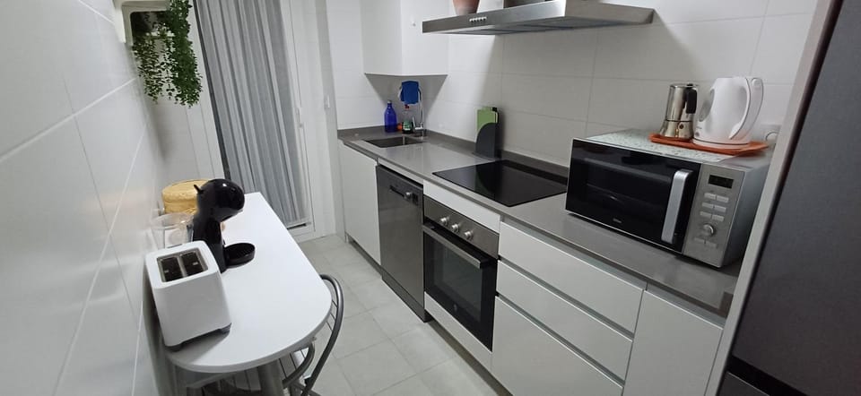 Kitchen or kitchenette, dishwasher, oven, stove, toaster