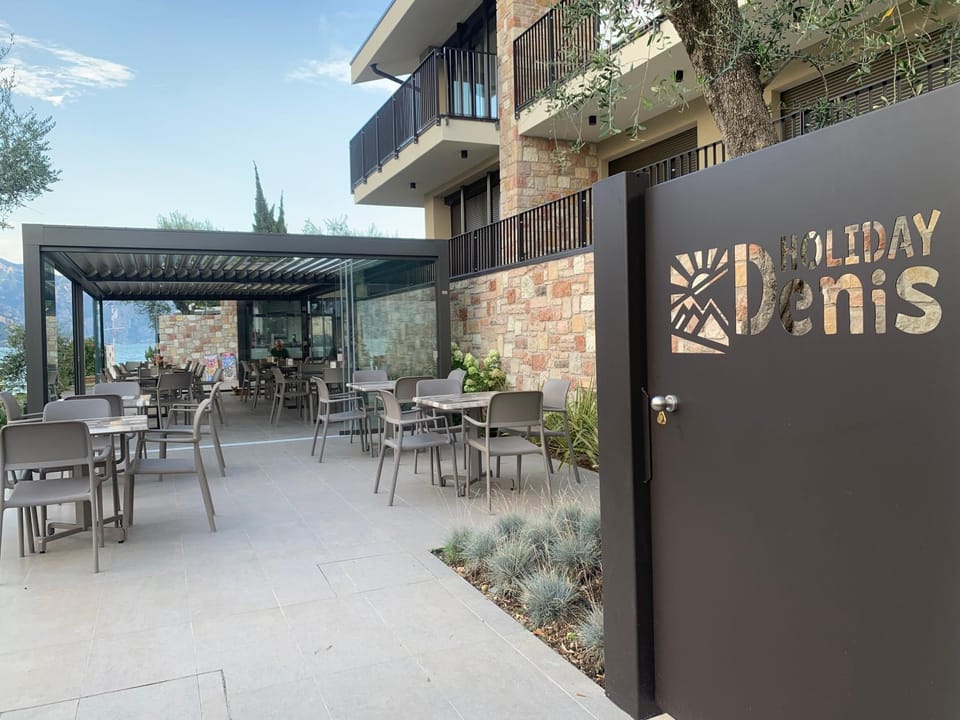 Property building, Patio, Property logo or sign, View (from property/room), Balcony/Terrace