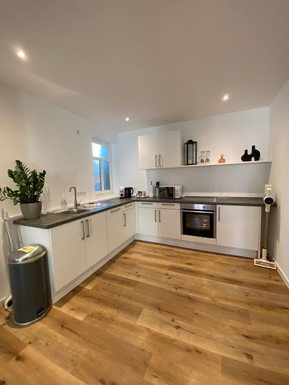 Kitchen or kitchenette, dishwasher, oven, stove