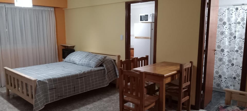 Bed, Living room, Seating area, Dining area