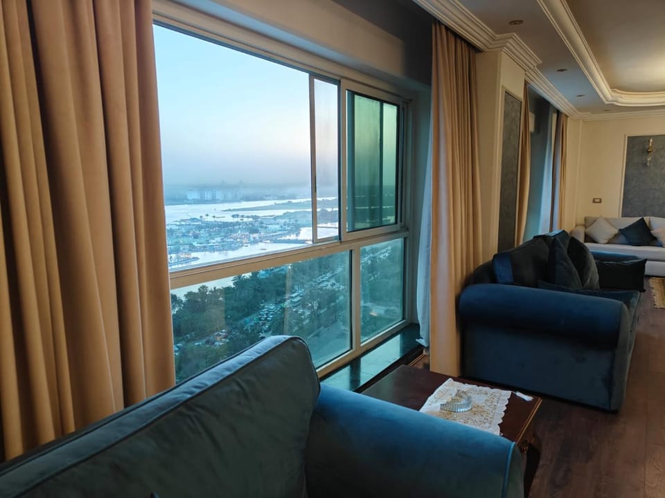 Natural landscape, View (from property/room), Living room, Seating area, Sea view