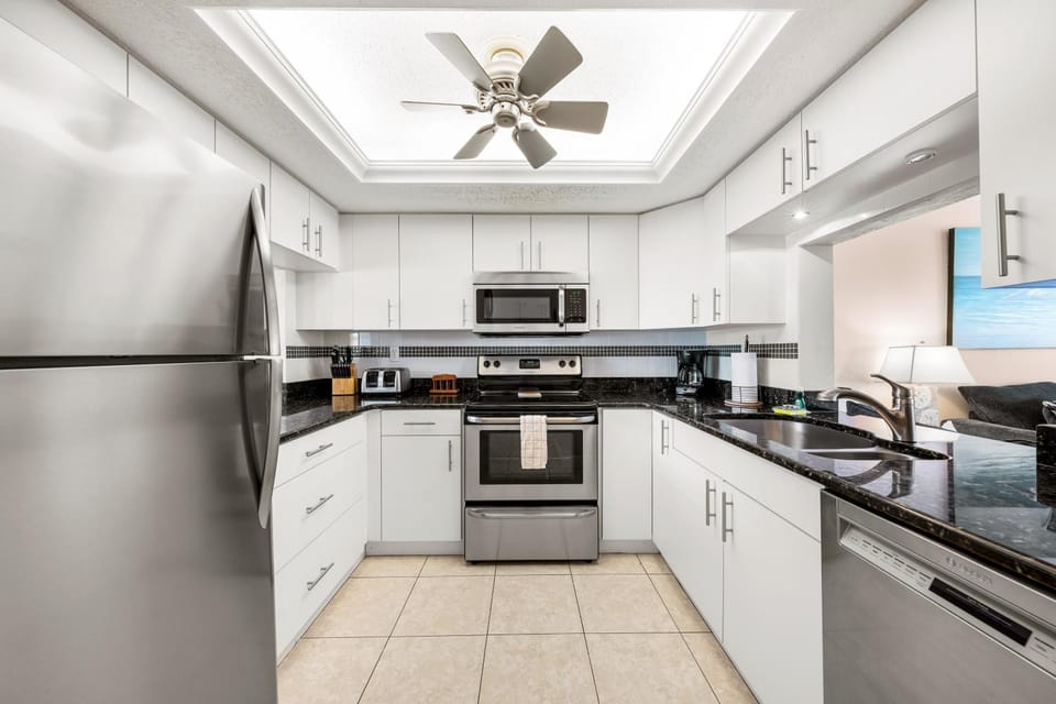 Kitchen or kitchenette, dishwasher, oven, stove