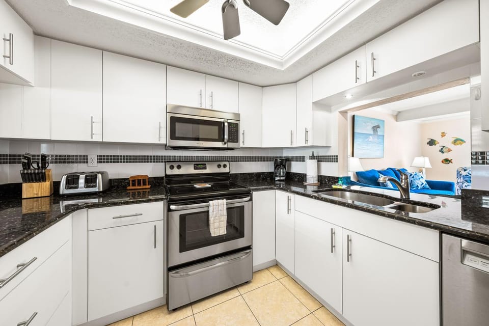 Kitchen or kitchenette, dishwasher, oven, stove, toaster