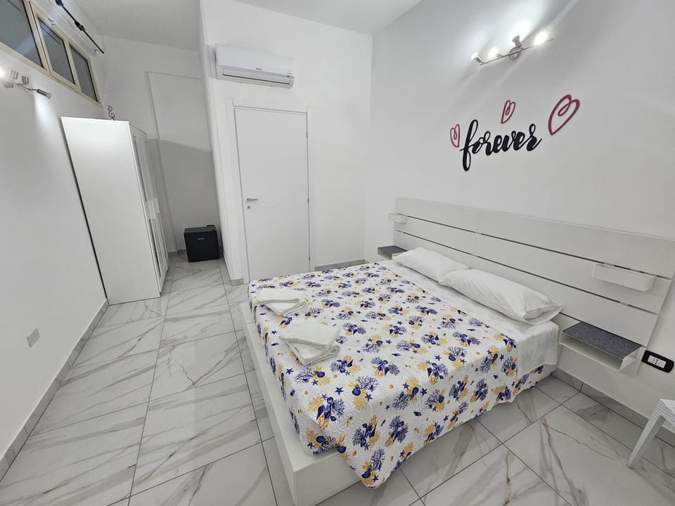 Photo of the whole room, towels, wardrobe, air conditioner