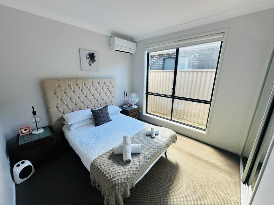Bed, Photo of the whole room, Bedroom, towels, air conditioner