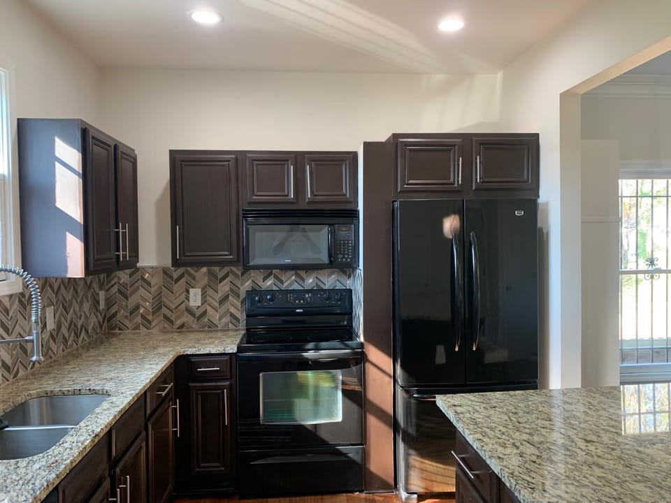 Kitchen or kitchenette, dishwasher, oven, stove, toaster