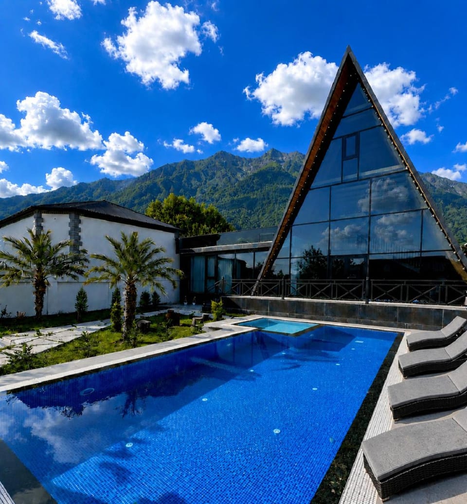 Property building, Nearby landmark, Day, Natural landscape, Mountain view, Pool view, Swimming pool, Swimming pool, sunbed