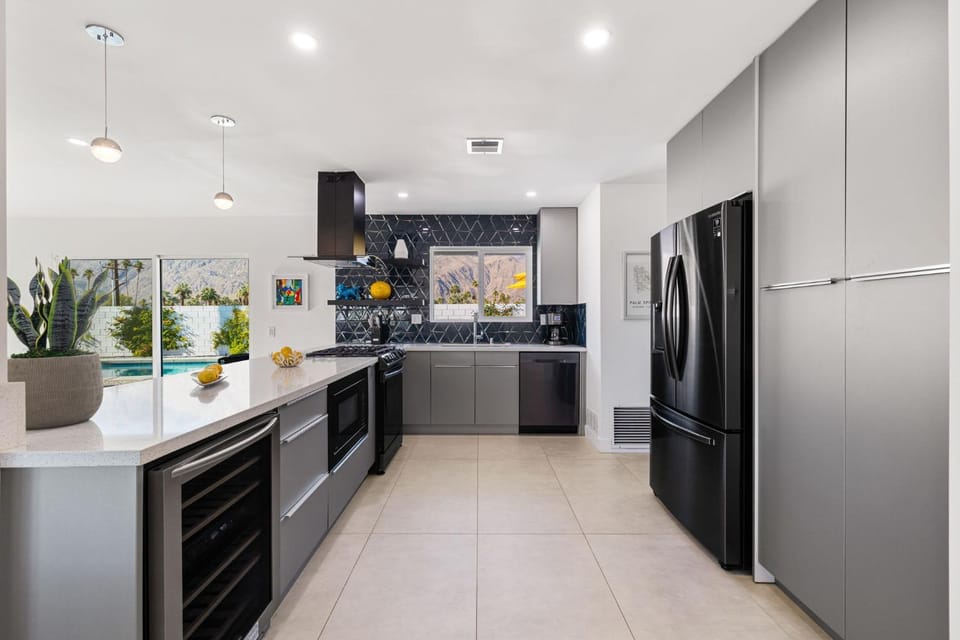 Kitchen or kitchenette, dishwasher, oven, stove