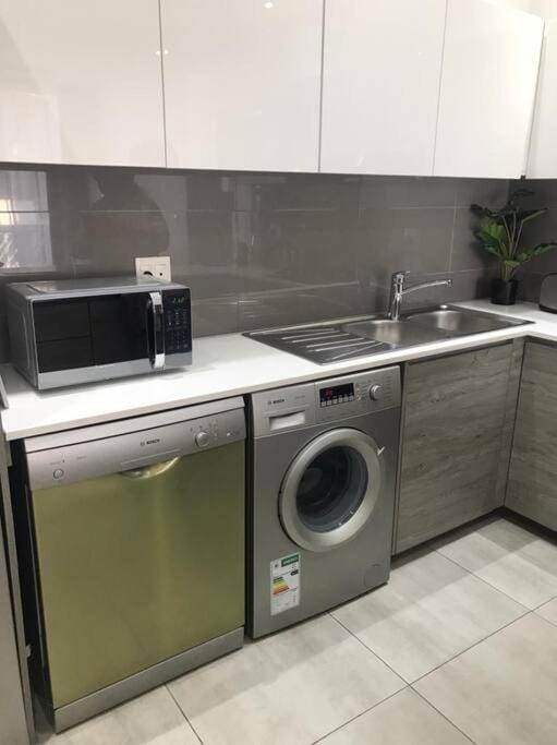 Kitchen or kitchenette, dishwasher, minibar, washing machine, dryer