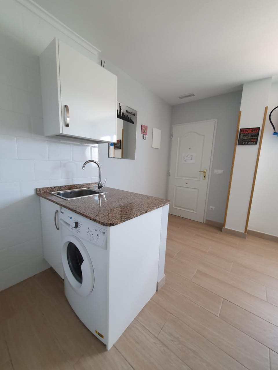 Kitchen or kitchenette, stove, washing machine