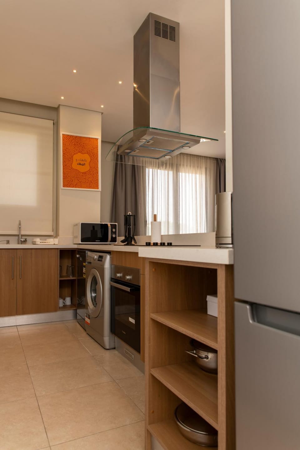Kitchen or kitchenette, microwave, oven, stove