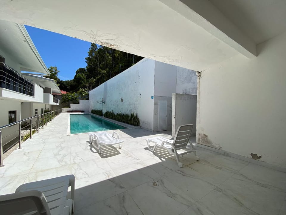Apto Térreo com 2 quartos (ambos com ar split), sendo 1 suíte, internet privativa 300MBPS, no Residencial Vila Regina, condominio com piscina e área gourmet bem próximo a praia de Taperapuã House in State of Bahia