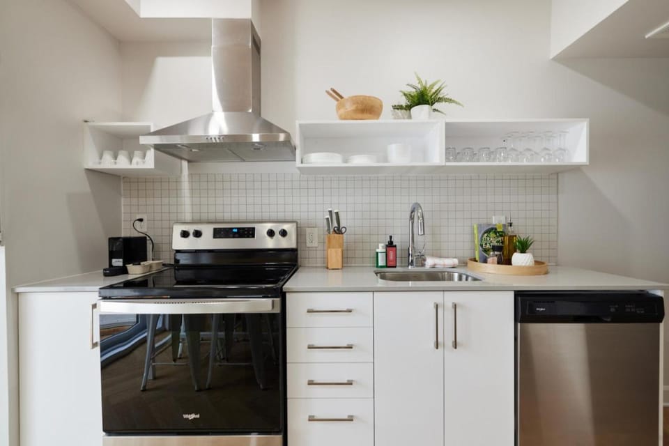 Kitchen or kitchenette, dishwasher, oven, stove