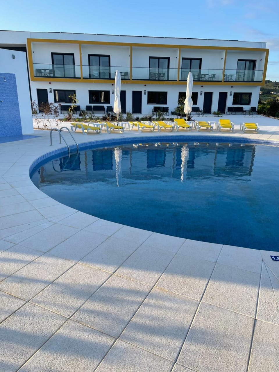 Property building, Patio, Pool view, Swimming pool, sunbed