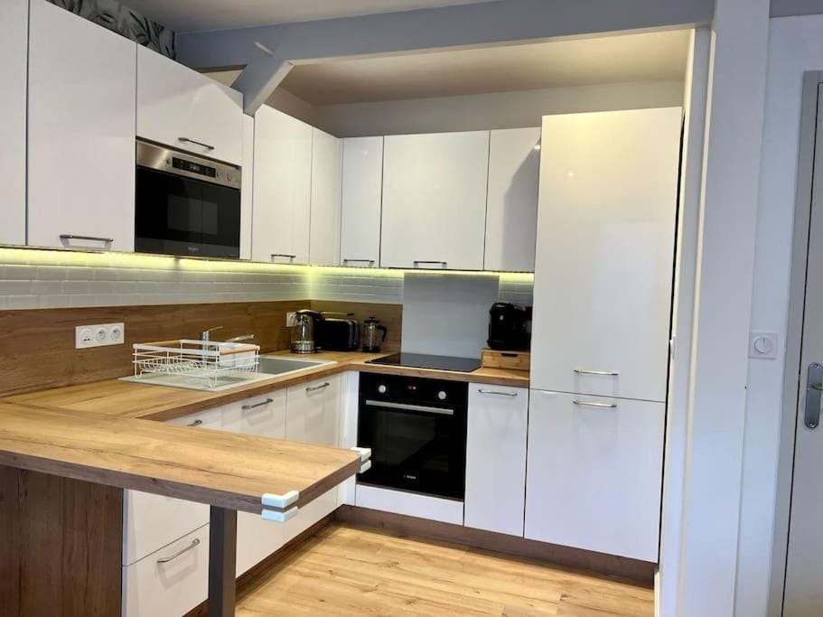 Kitchen or kitchenette, dishwasher, oven, stove, toaster