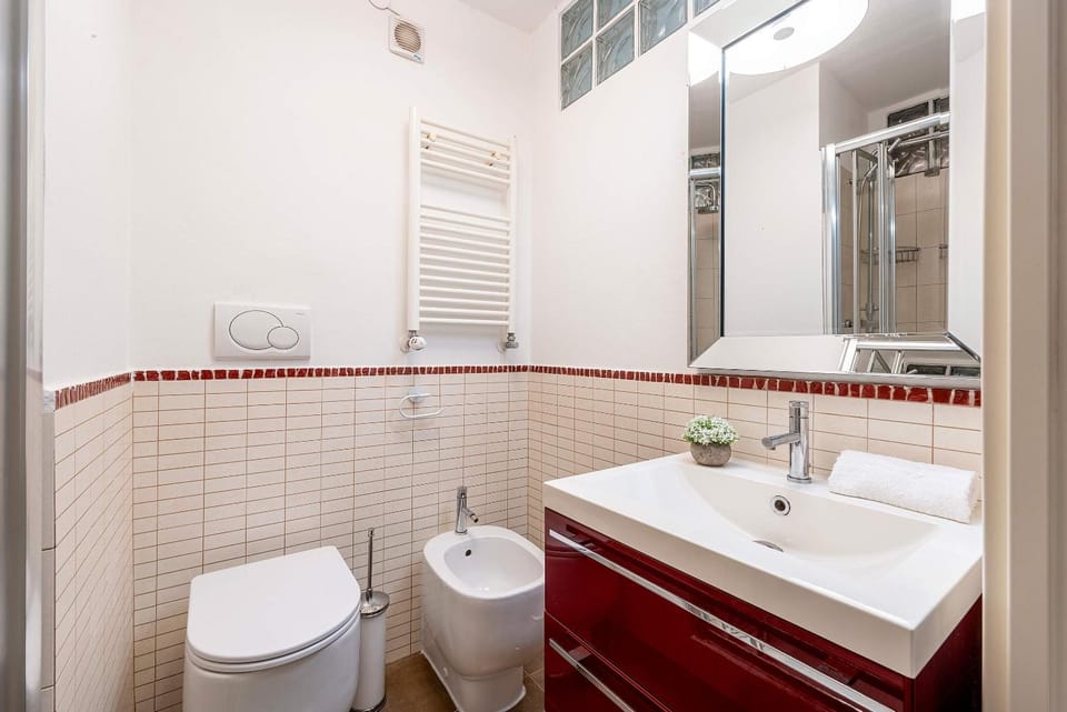 Toilet, Bathroom, bidet, hair dryier, towels