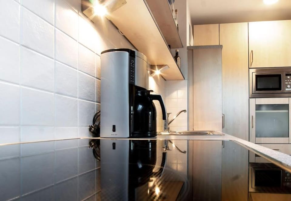 Kitchen or kitchenette, stove